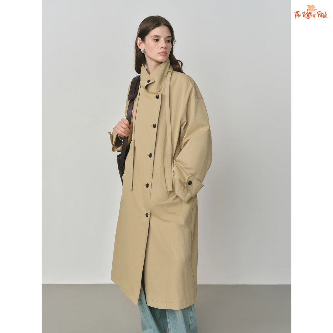 Women’s Oversized Casual Trench Coat 2026 with long length, lace-up decoration, turndown collar, and wide-waisted fit in pink-beige gradient style.