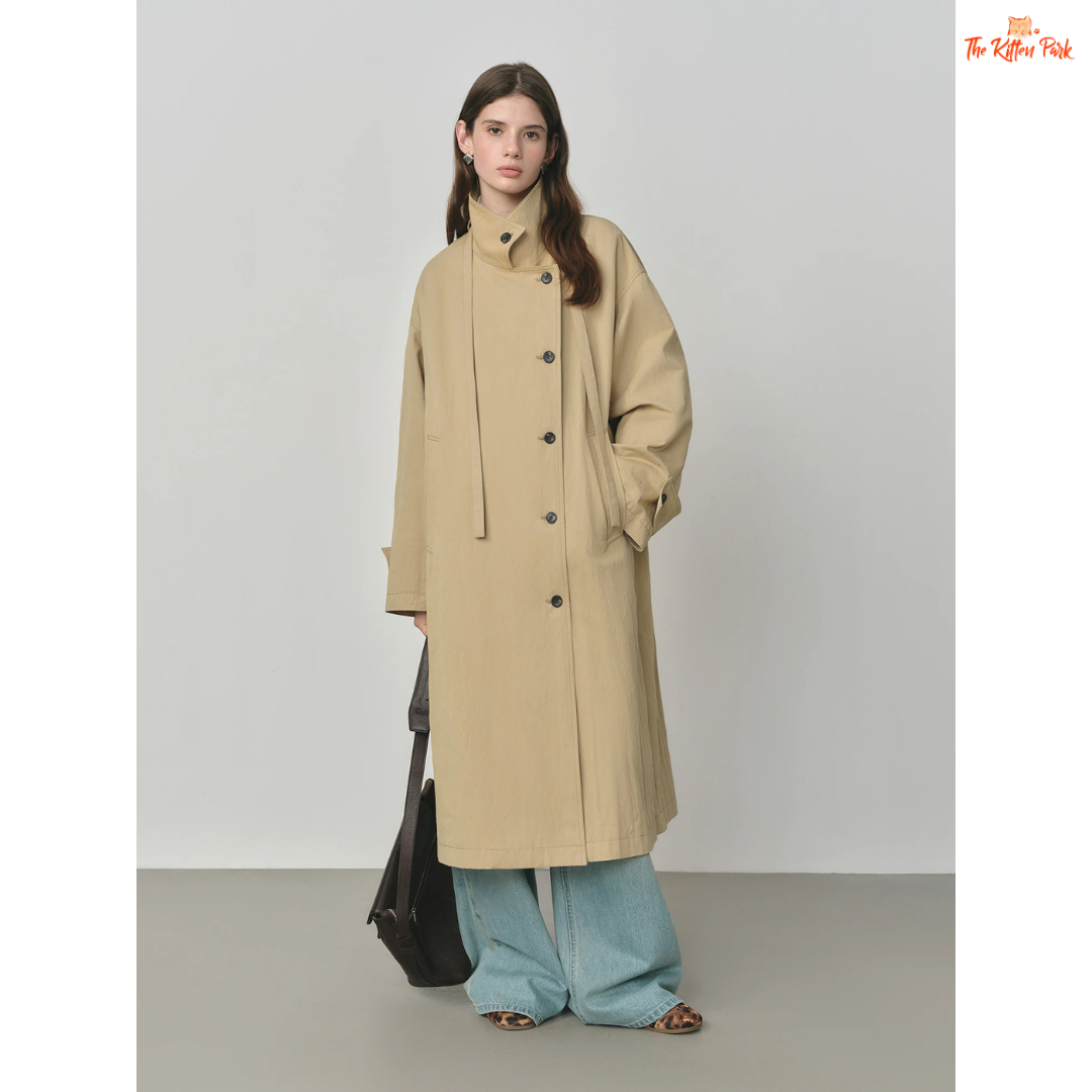 Women’s Oversized Casual Trench Coat 2026 with long length, lace-up decoration, turndown collar, and wide-waisted fit in pink-beige gradient style.