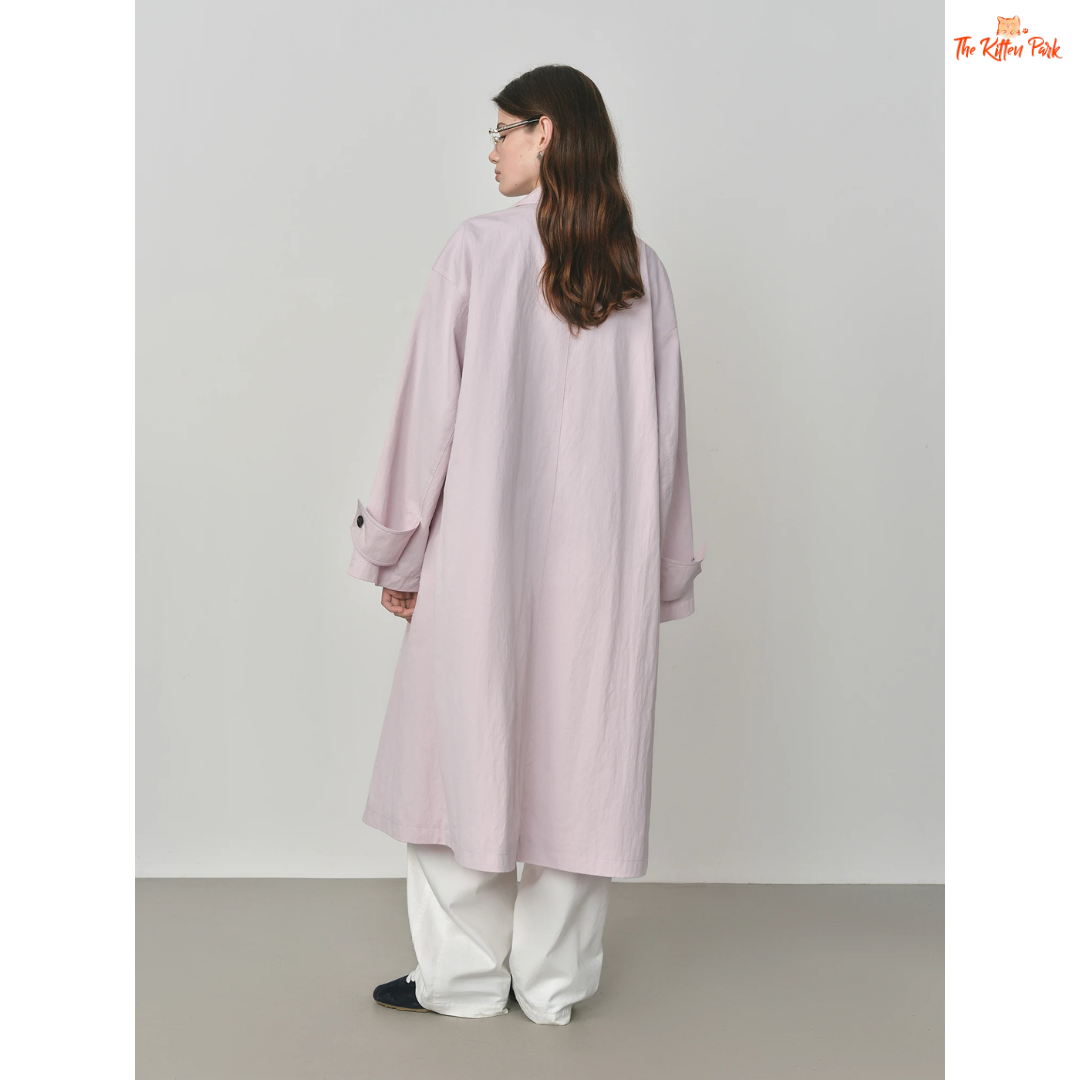 Women’s Oversized Casual Trench Coat 2026 with long length, lace-up decoration, turndown collar, and wide-waisted fit in pink-beige gradient style.