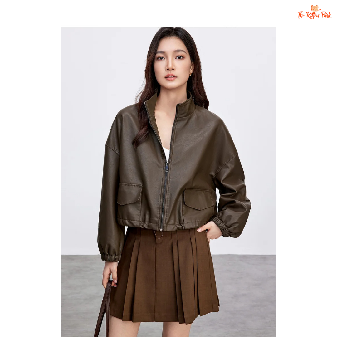 Woman wearing a brown jacket and skirt on a white background