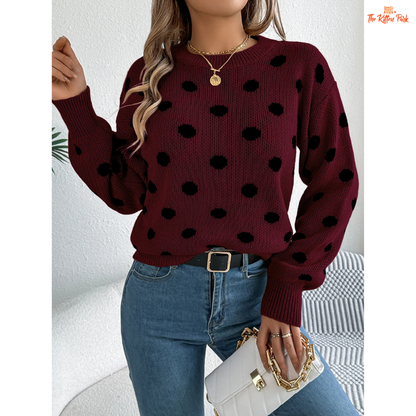 A women’s heavyweight acrylic polka dot knit sweater with lantern sleeves, O-neck, pockets, and regular fit for autumn and winter.