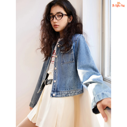 Women’s retro short denim jacket in blue cotton with turn-down collar, single-breasted closure, and buttons, styled for casual spring and summer outfits.