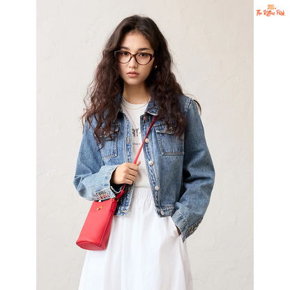 Women’s retro short denim jacket in blue cotton with turn-down collar, single-breasted closure, and buttons, styled for casual spring and summer outfits.