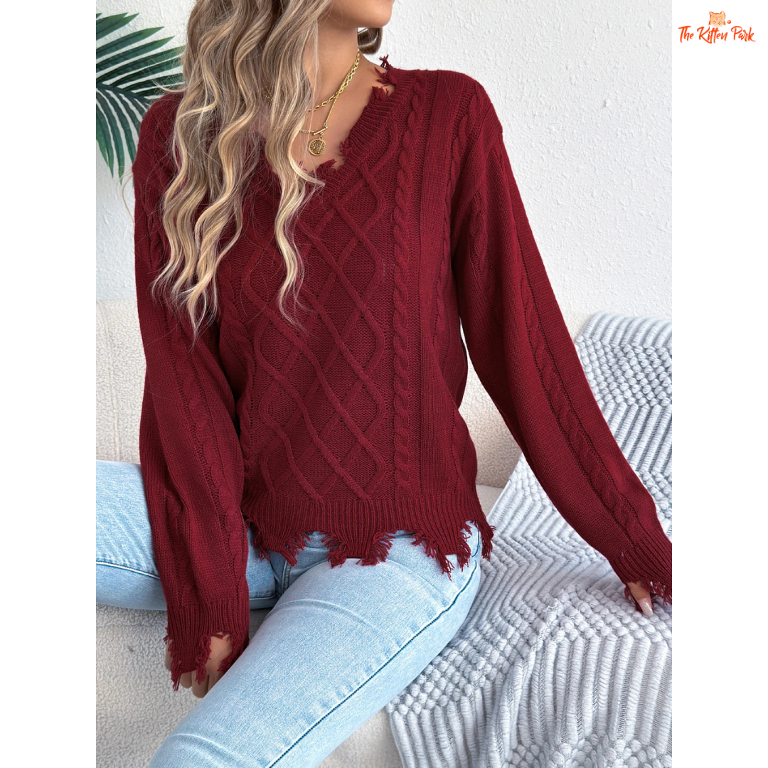 A women’s heavyweight acrylic V-neck sweater with ripped tassel detailing, full sleeves, and a regular fit, designed for casual autumn and winter outfits.