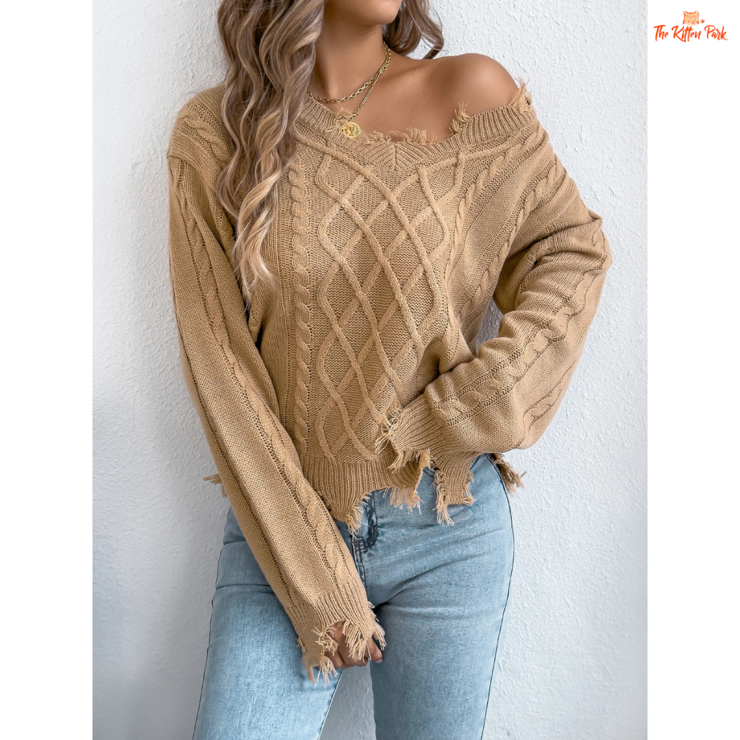 A women’s heavyweight acrylic V-neck sweater with ripped tassel detailing, full sleeves, and a regular fit, designed for casual autumn and winter outfits.