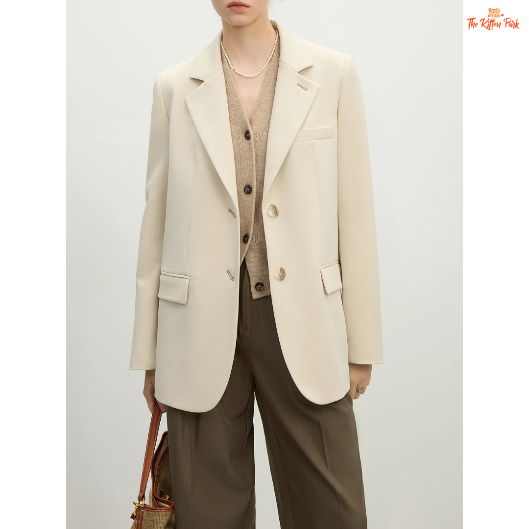 Elegant women’s versatile blazer in light green and off-white tones, featuring a loose fit, single-breasted closure, and notched collar for spring and summer office wear.