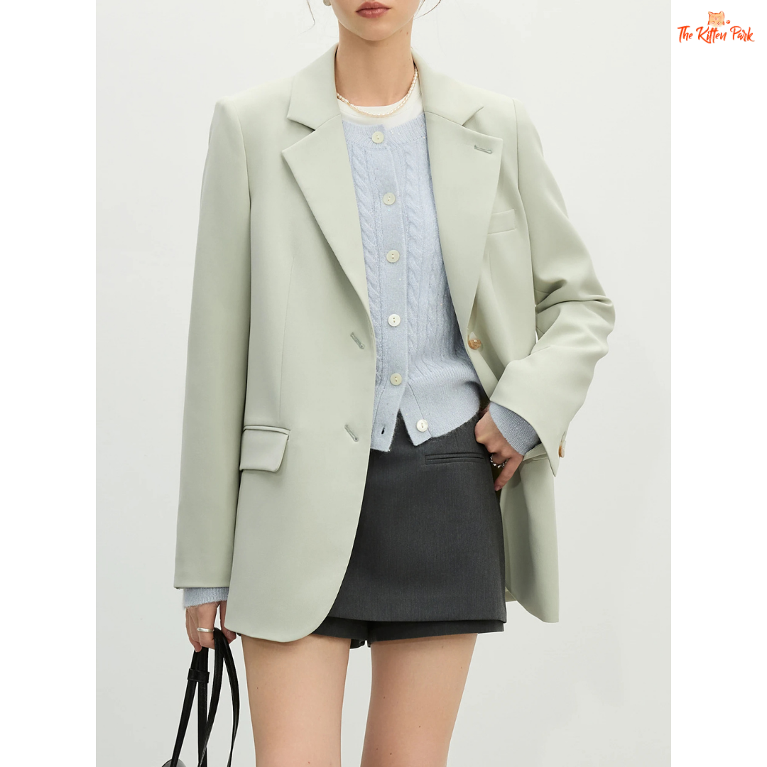 Elegant women’s versatile blazer in light green and off-white tones, featuring a loose fit, single-breasted closure, and notched collar for spring and summer office wear.