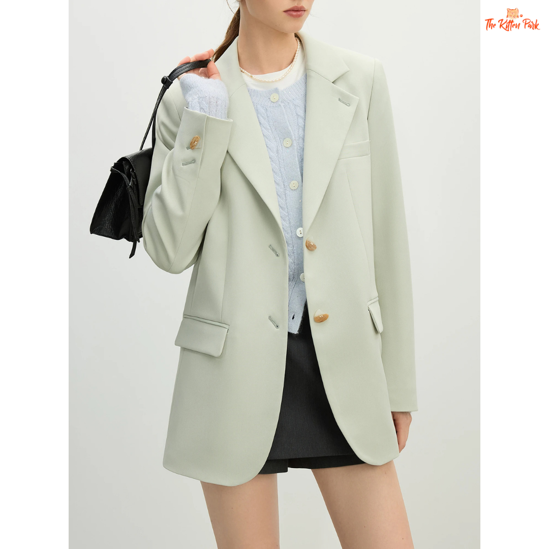 Elegant women’s versatile blazer in light green and off-white tones, featuring a loose fit, single-breasted closure, and notched collar for spring and summer office wear.