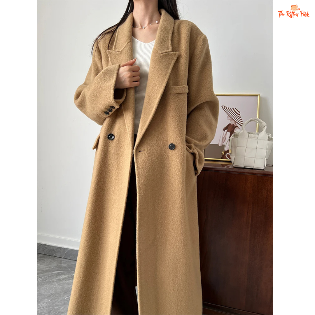 Women’s long wool coat with double-breasted closure, turn-down collar, wide-waisted fit, and button-pocket details in solid design.