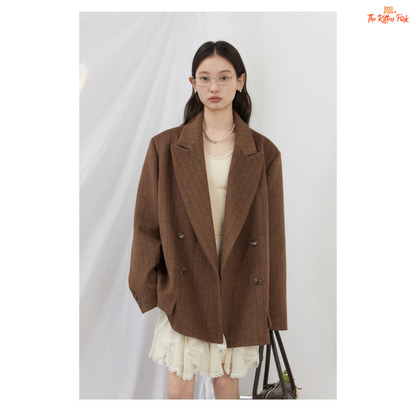 A women’s vintage woolen blazer with a V-neck, double-breasted closure, striped pattern, and loose fit, ideal for autumn and winter office wear.