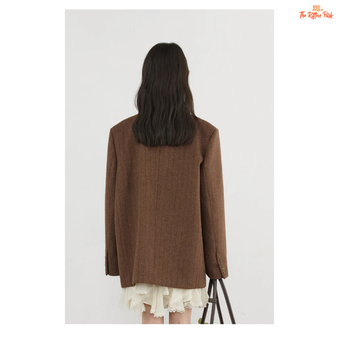 A women’s vintage woolen blazer with a V-neck, double-breasted closure, striped pattern, and loose fit, ideal for autumn and winter office wear.