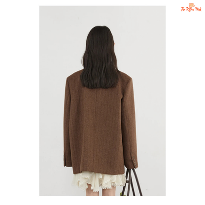 A women’s vintage woolen blazer with a V-neck, double-breasted closure, striped pattern, and loose fit, ideal for autumn and winter office wear.