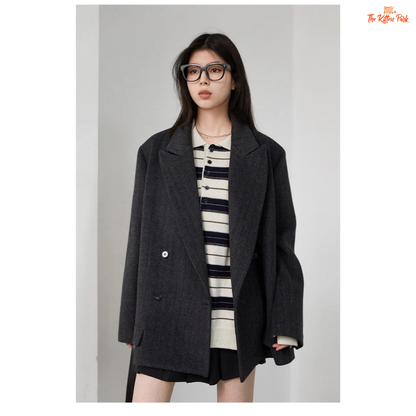 A women’s vintage woolen blazer with a V-neck, double-breasted closure, striped pattern, and loose fit, ideal for autumn and winter office wear.