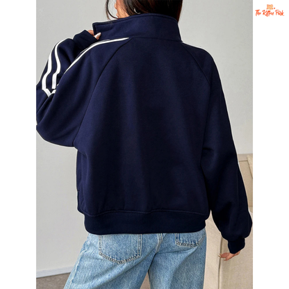 A light navy blue women's zipper sports coat with pockets, striped knit pattern, turtleneck collar, and warm fur liner for autumn streetwear looks.