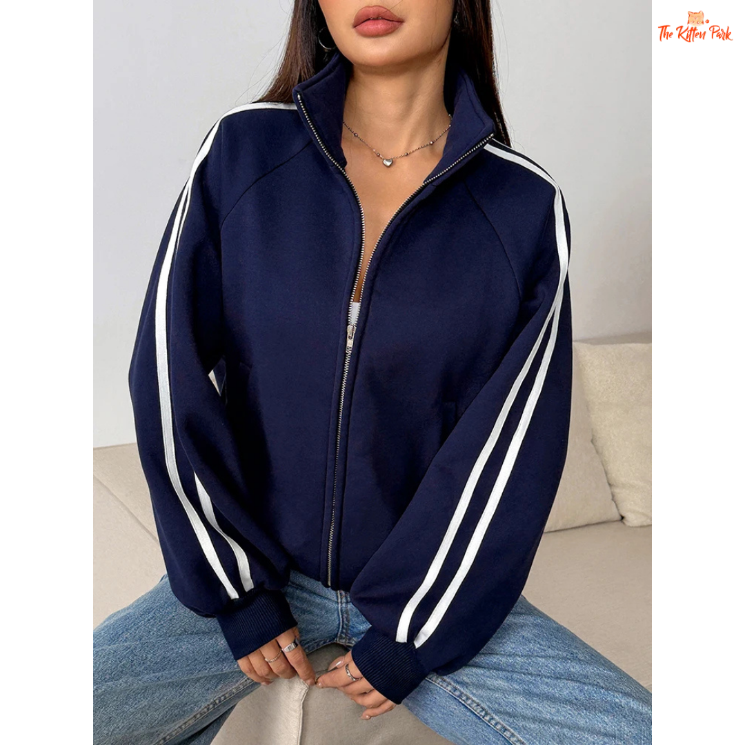 A light navy blue women's zipper sports coat with pockets, striped knit pattern, turtleneck collar, and warm fur liner for autumn streetwear looks.