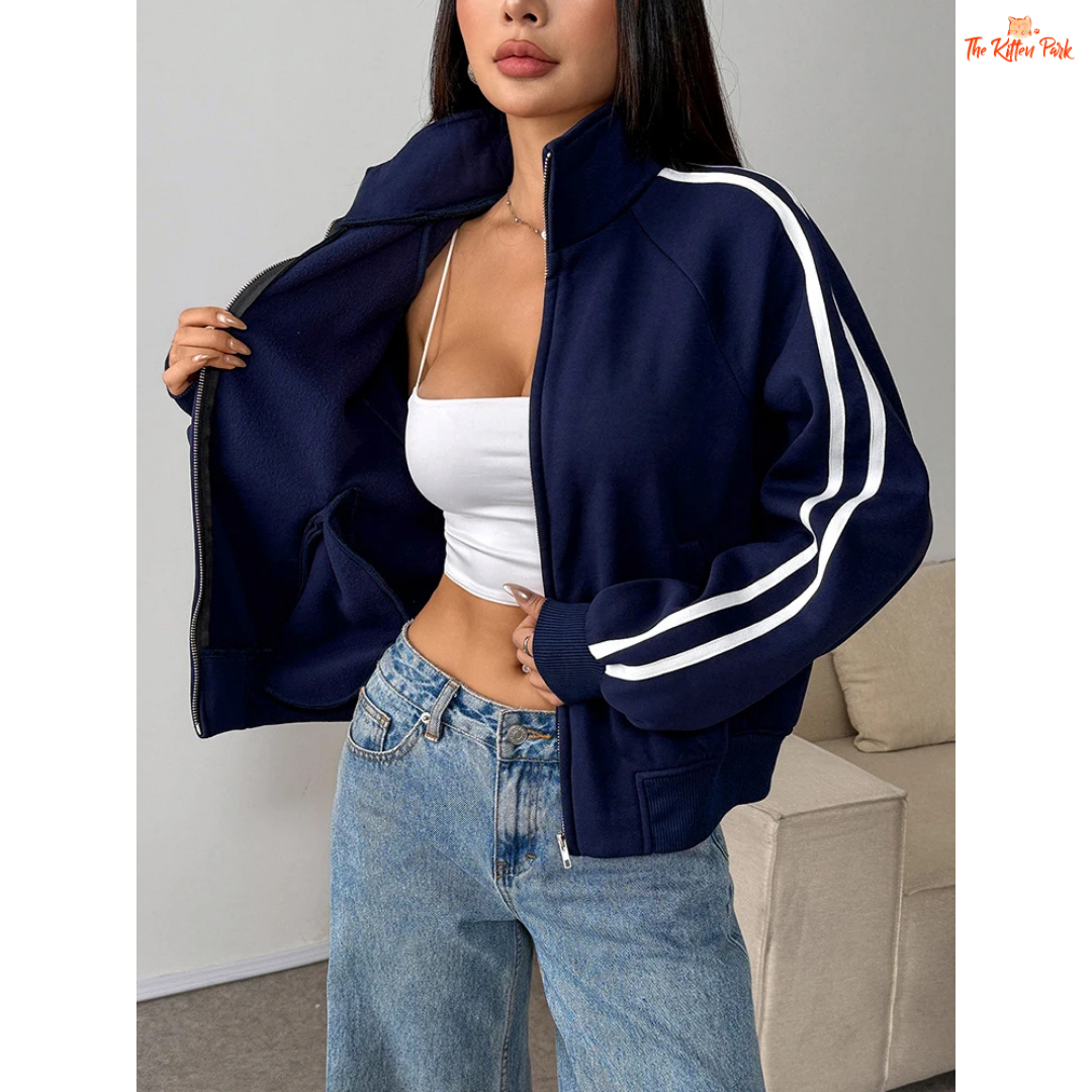 A light navy blue women's zipper sports coat with pockets, striped knit pattern, turtleneck collar, and warm fur liner for autumn streetwear looks.