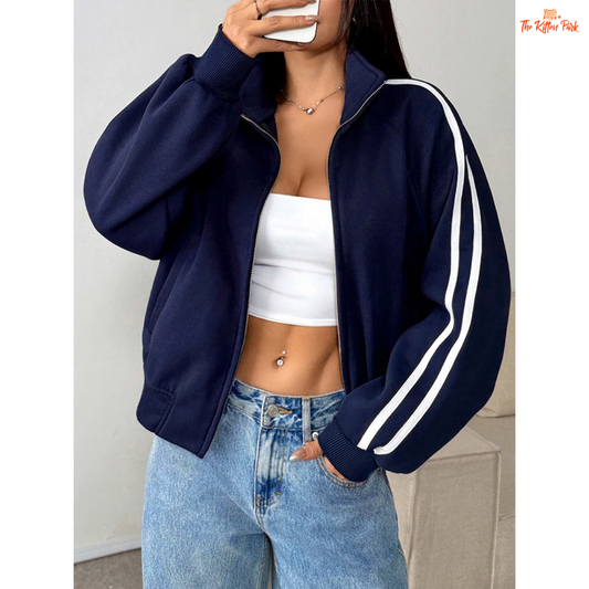 A light navy blue women's zipper sports coat with pockets, striped knit pattern, turtleneck collar, and warm fur liner for autumn streetwear looks.