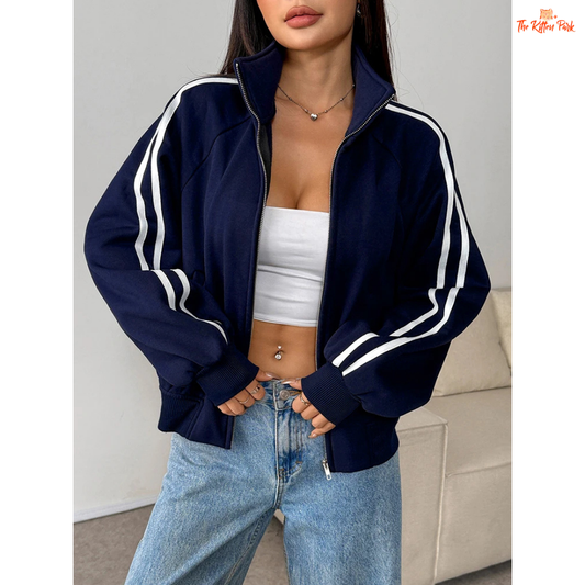 A light navy blue women's zipper sports coat with pockets, striped knit pattern, turtleneck collar, and warm fur liner for autumn streetwear looks.