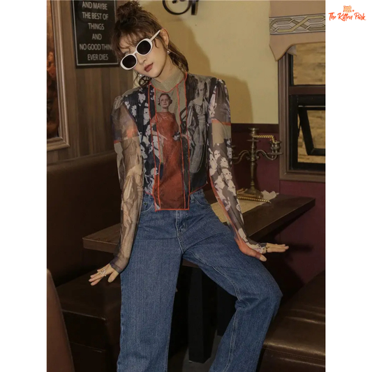 Beige asymmetrical mesh blouse for women with patchwork character print, puff sleeves, turtleneck collar, and slim vintage fit.