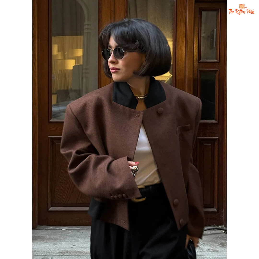 Coffee brown women's vintage lapel short jacket with full sleeves, pockets, and turtleneck collar for casual autumn wear.