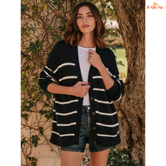 Woman wearing a black and white striped cardigan outdoors