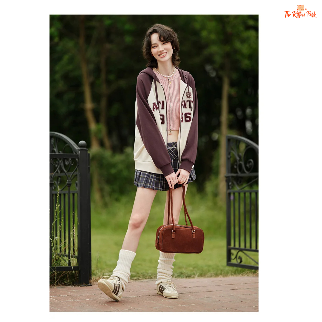 A women’s hooded embroidered jacket with a loose fit, color-block design, zipper closure, full sleeves, and casual autumn style.