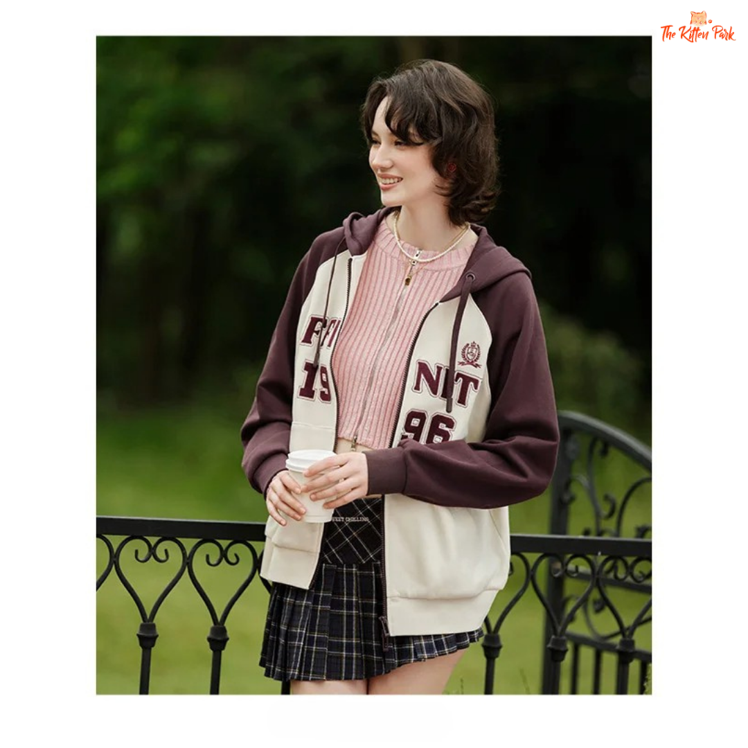 A women’s hooded embroidered jacket with a loose fit, color-block design, zipper closure, full sleeves, and casual autumn style.