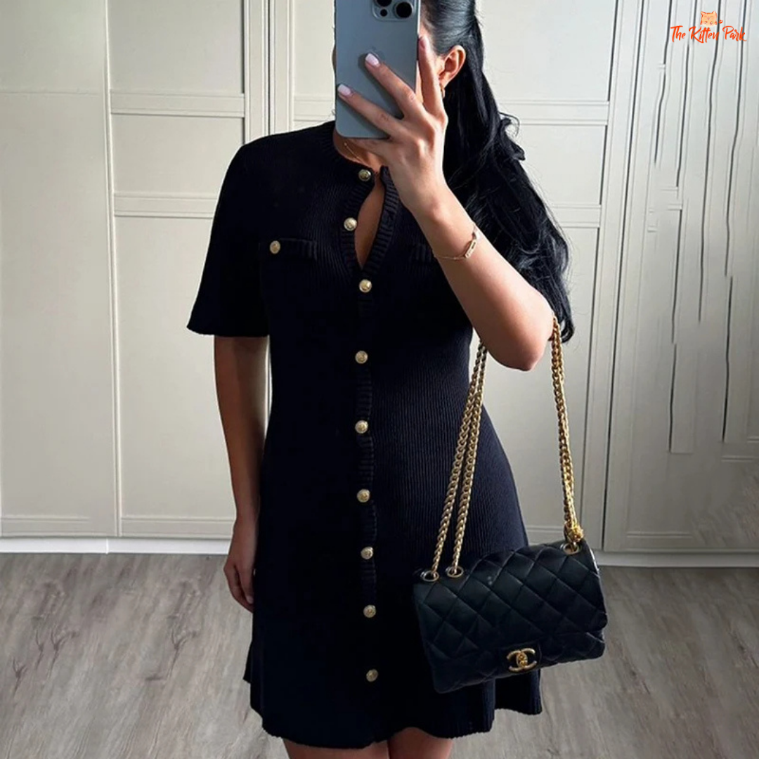Black ribbed knit mini dress with metal buttons, slim fit design, and soft texture, ideal for autumn casual elegance.