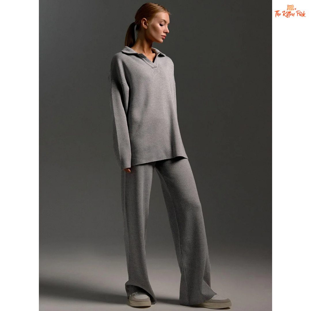 Woman wearing a gray outfit against a plain background