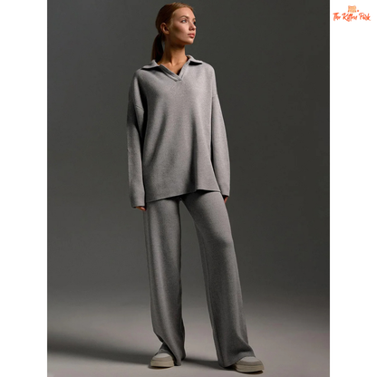 Woman wearing a gray outfit against a dark background