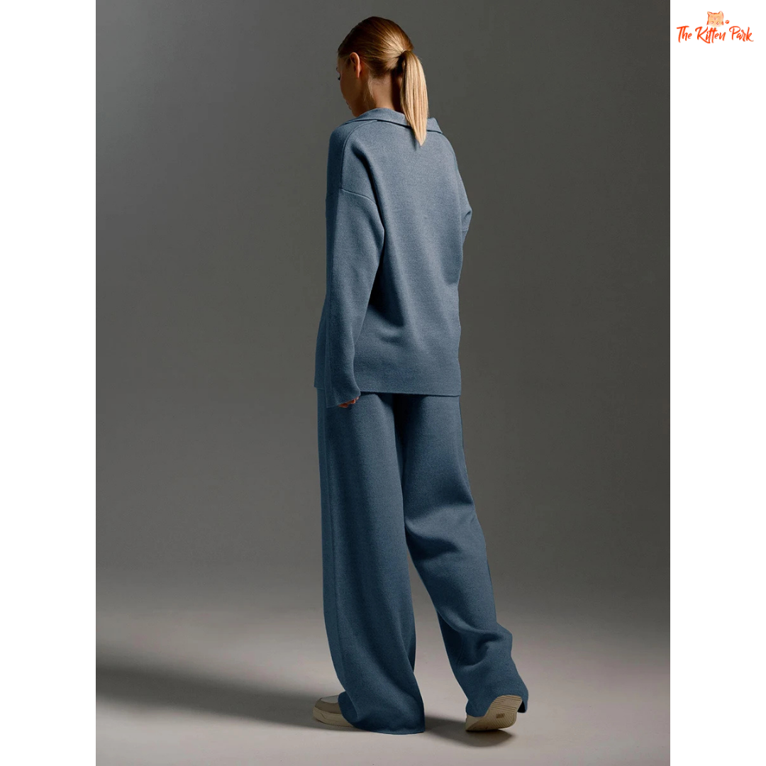 Person wearing a blue outfit against a gray background