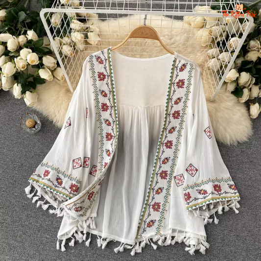 Boho-style chiffon cardigan with embroidery and tassel waist, perfect for layering in spring and summer.