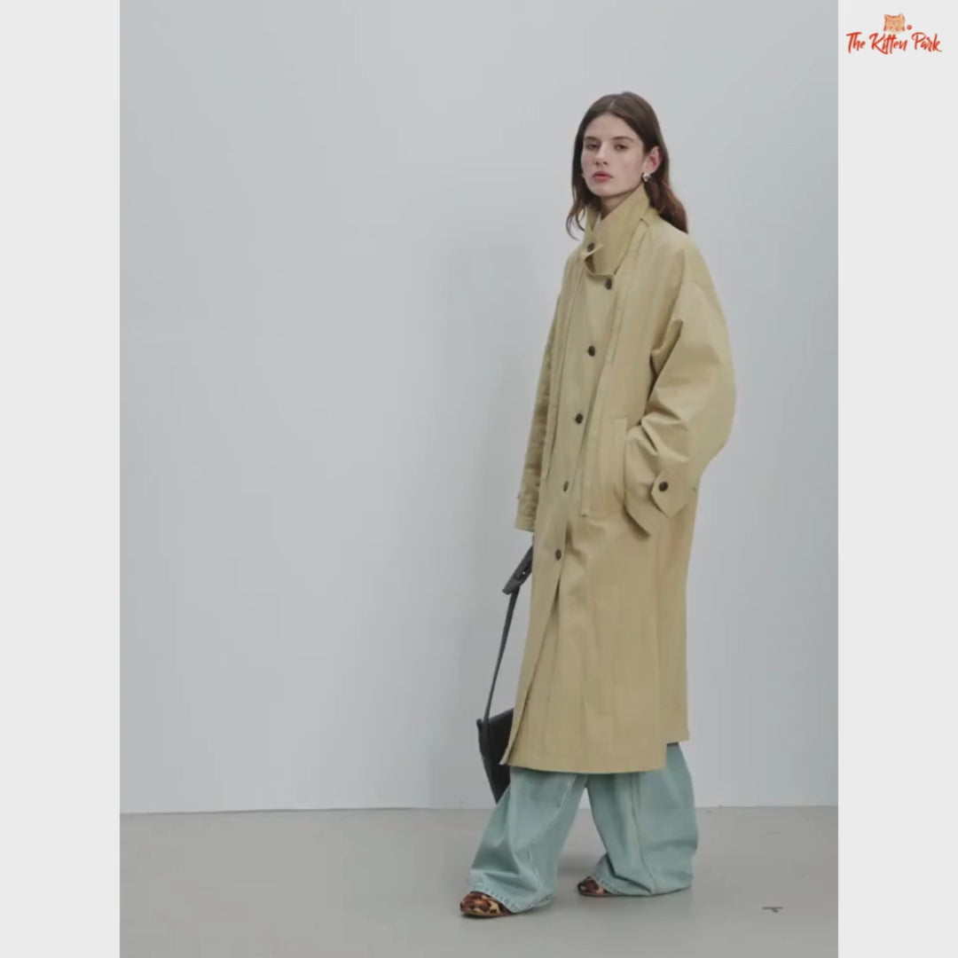 Women’s Oversized Casual Trench Coat 2026 with long length, lace-up decoration, turndown collar, and wide-waisted fit in pink-beige gradient style.