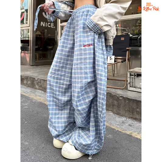 High waist Y2K plaid pants with lace-up detail and wide leg design, made of cotton and polyester, perfect for spring/summer streetwear.