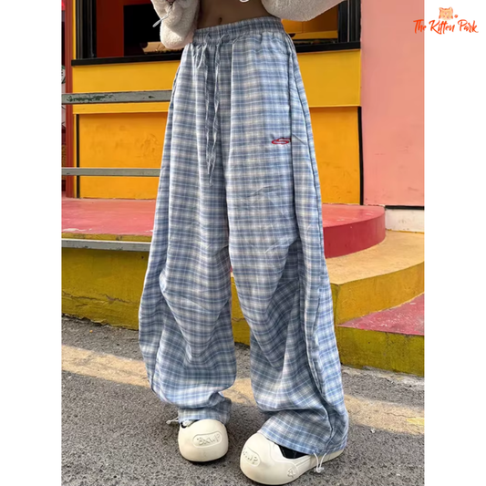 High waist Y2K plaid pants with lace-up detail and wide leg design, made of cotton and polyester, perfect for spring/summer streetwear.